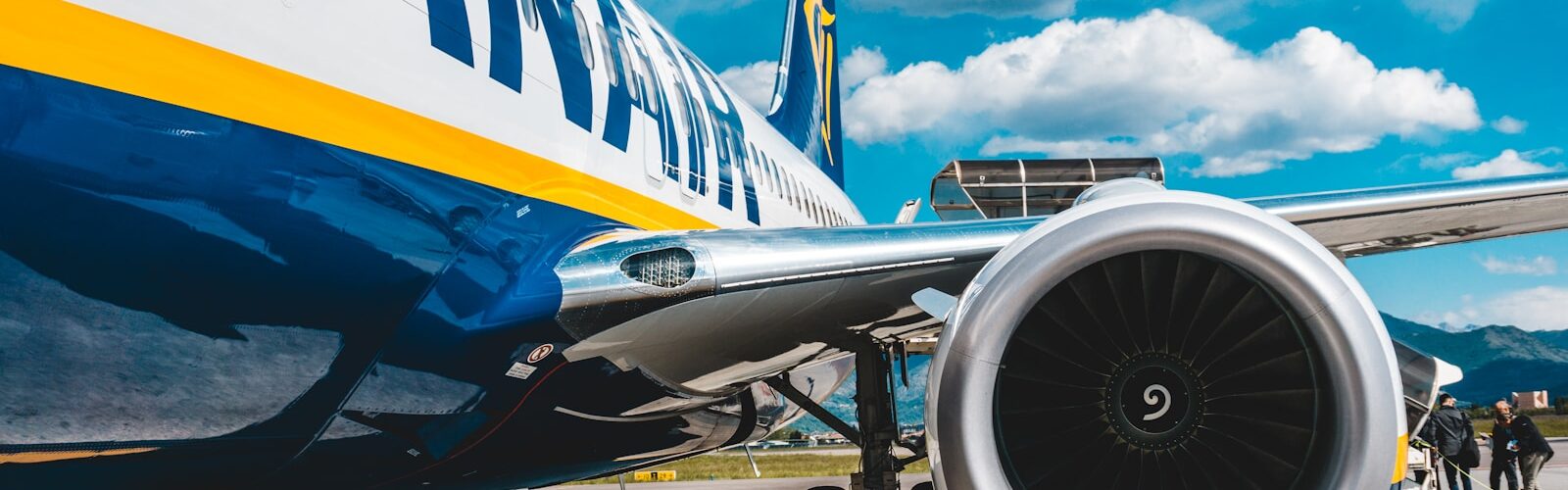 photo of blue and white passenger plane turbine
